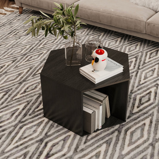 Dark wood hexagonal end table with open shelving holding books