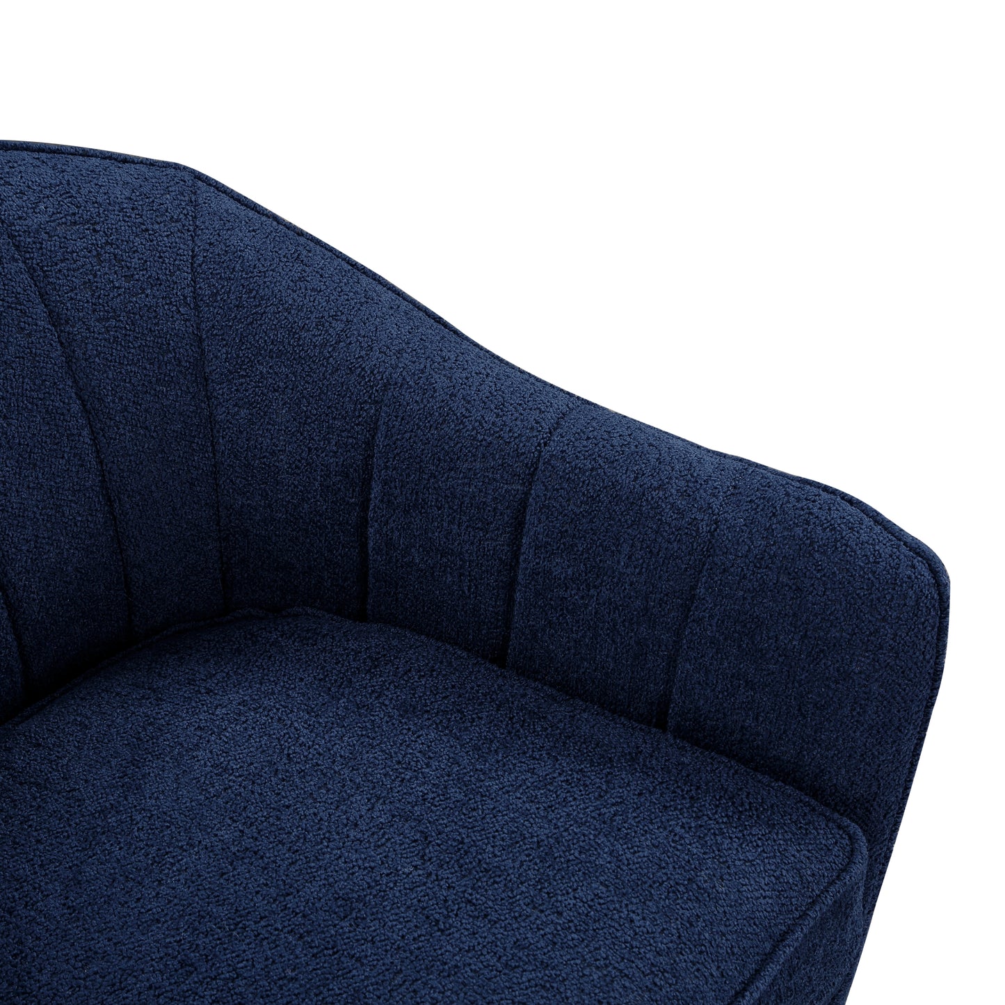 Closeup of a plush navy blue armchair cushion with textured fabric