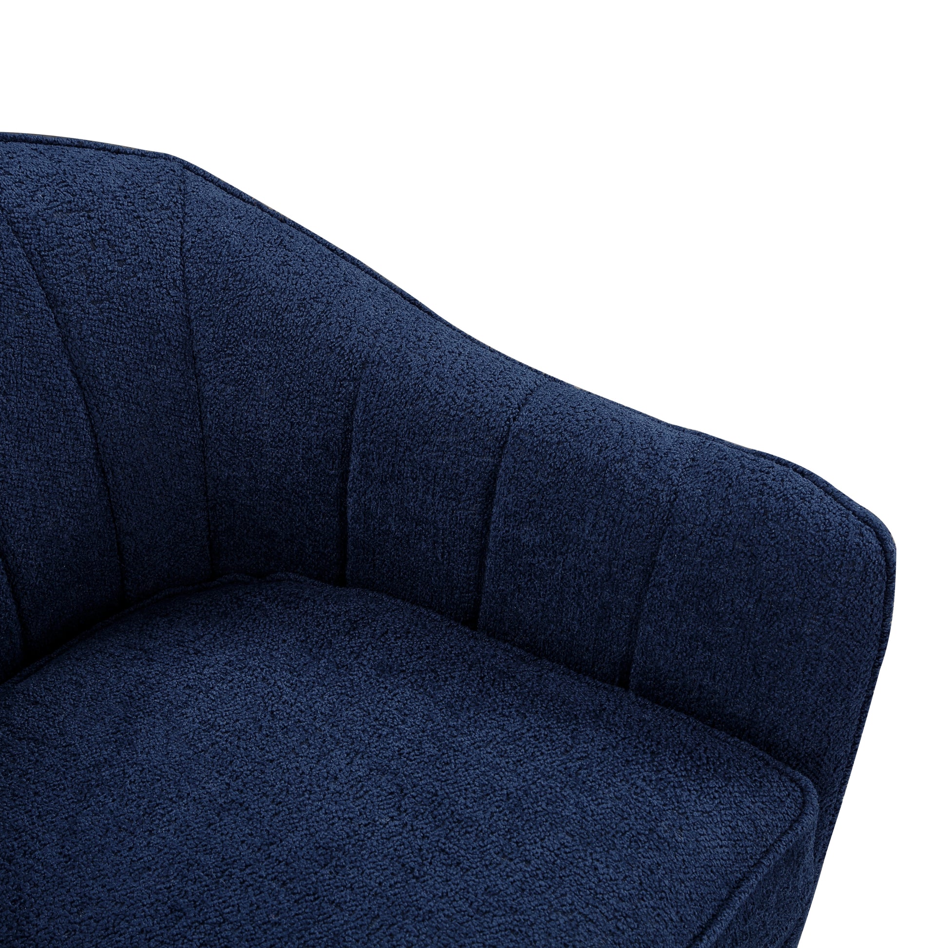 Closeup of a plush navy blue armchair cushion with textured fabric