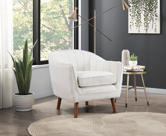 White boucle accent chair with channel tufting and tapered wooden legs