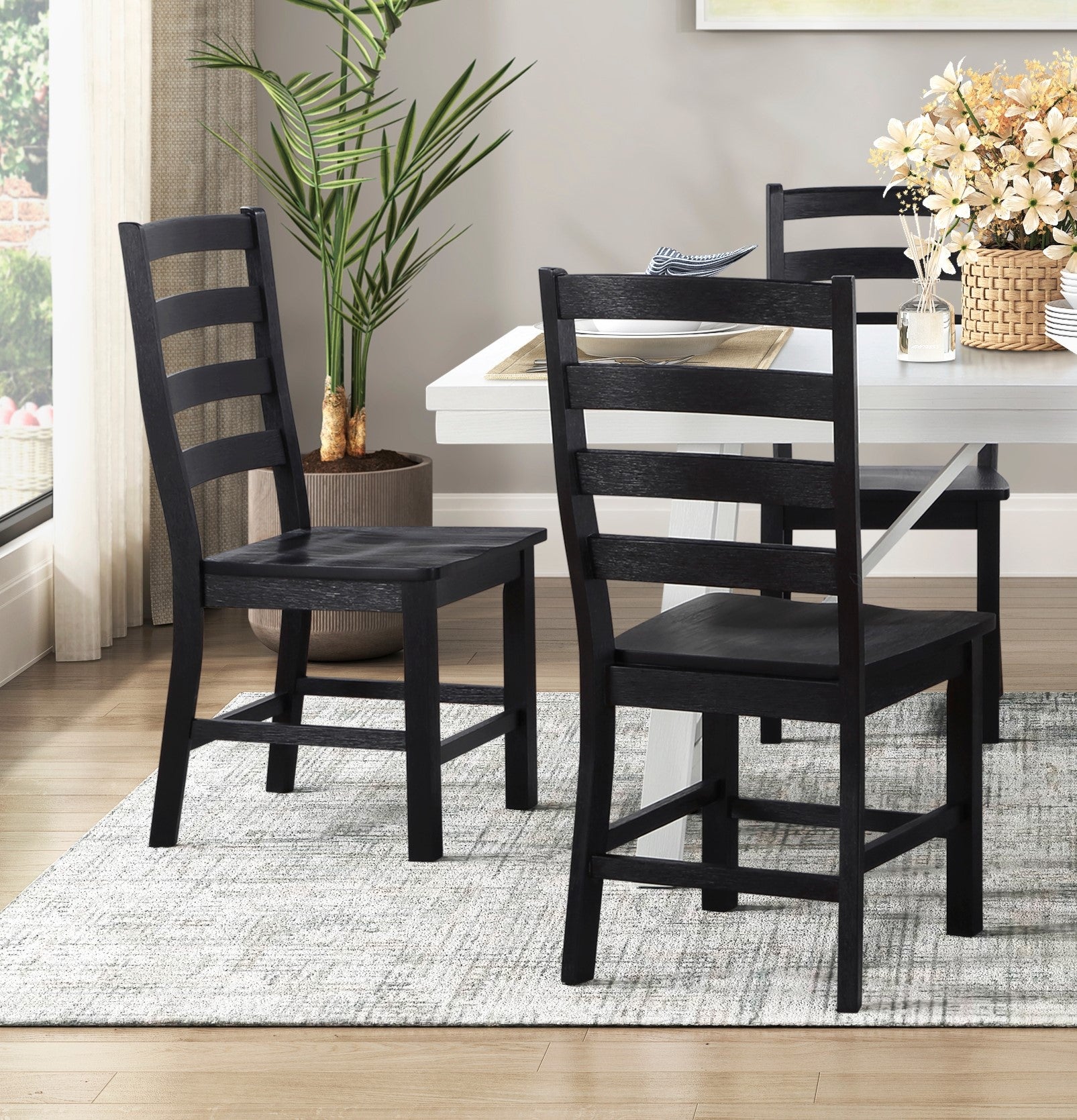 Black wooden dining chair with ladder back design