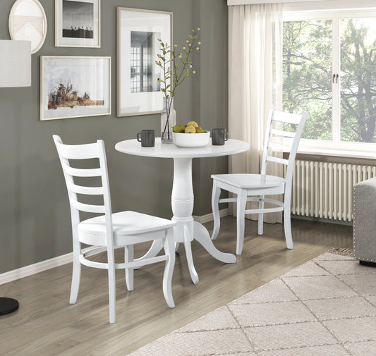 White round pedestal dining table with two ladderback chairs ideal for small spaces