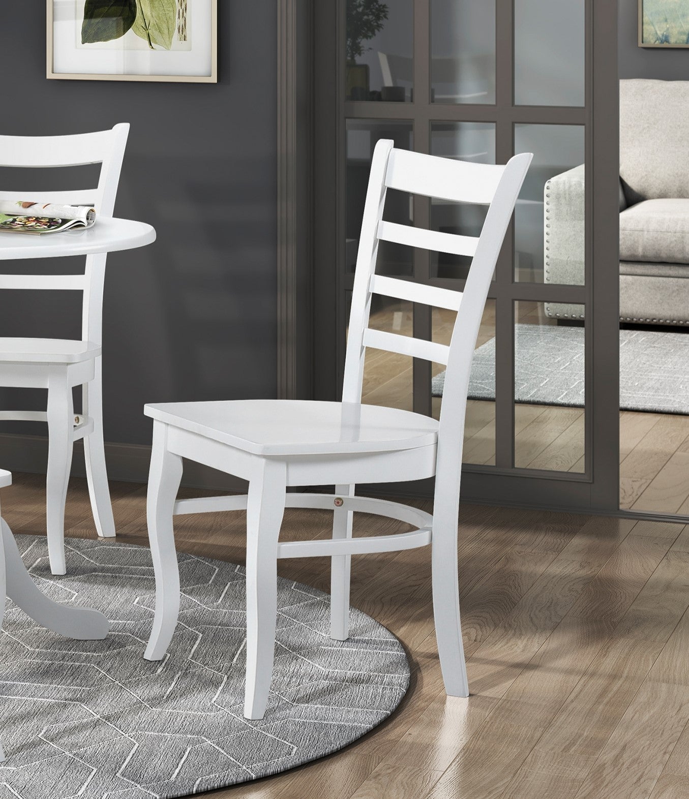 White ladder back dining chair with curved legs perfect for modern kitchens