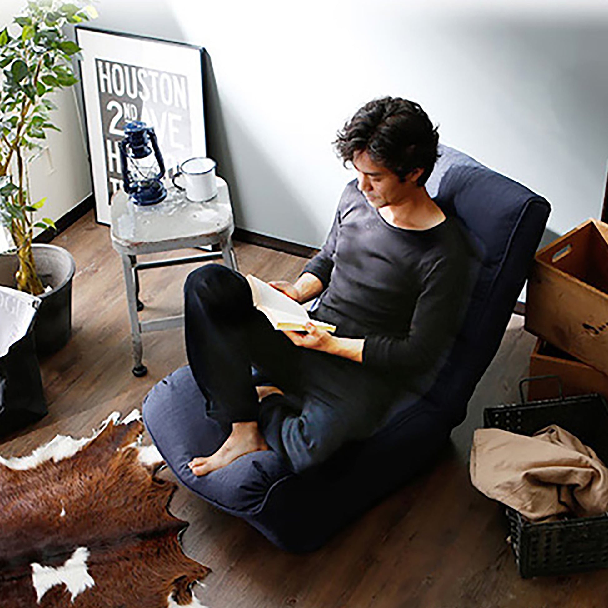 Deep blue floor chair with adjustable back perfect for reading and relaxing