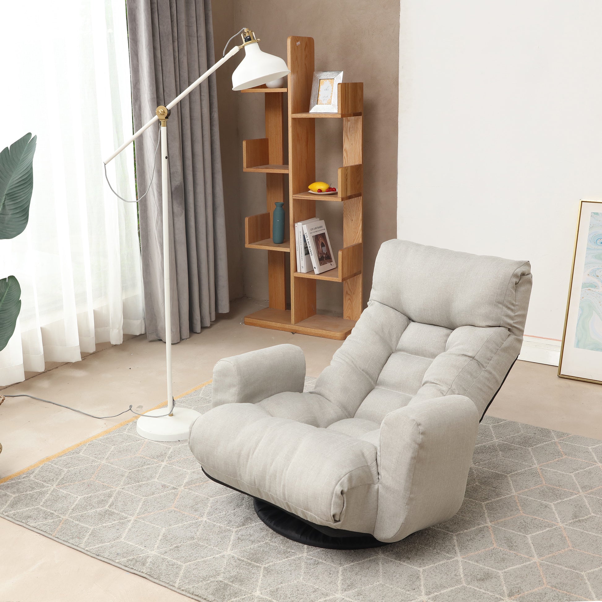 Comfortable light gray linen swivel chair with plush cushions and armrests