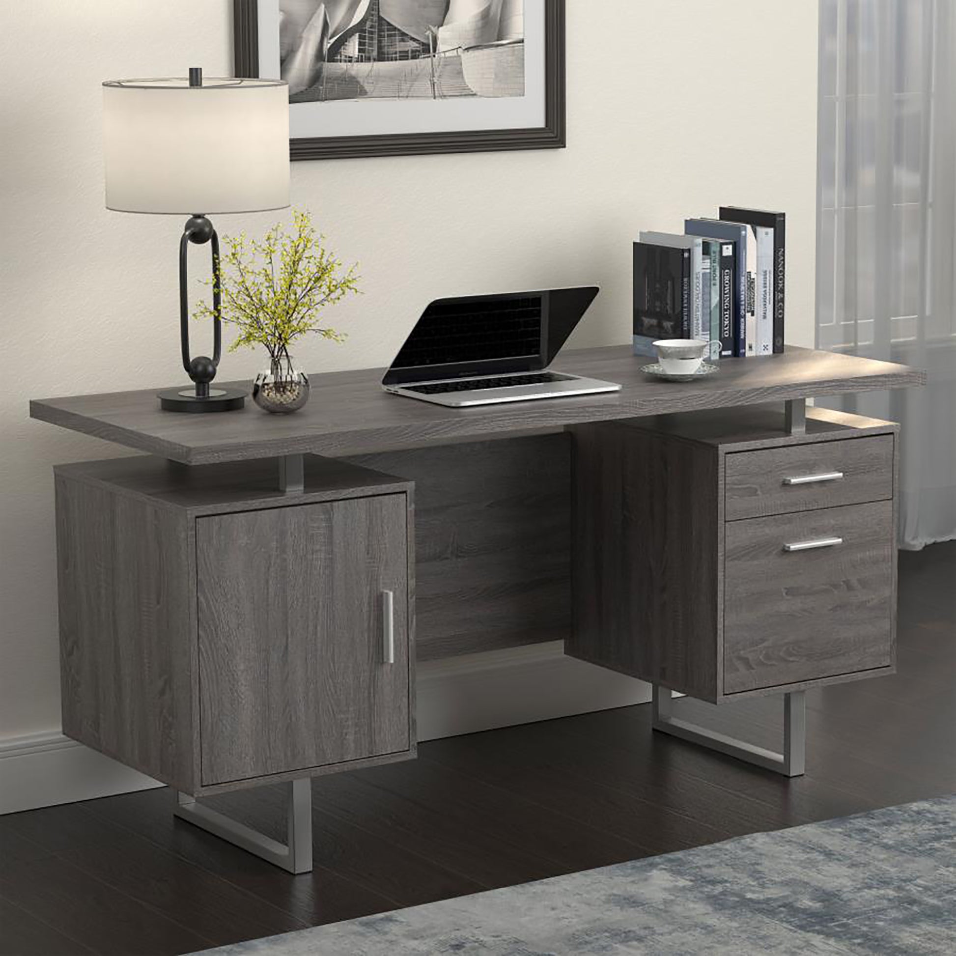 Modern grey wood executive desk with a sleek design and silver legs