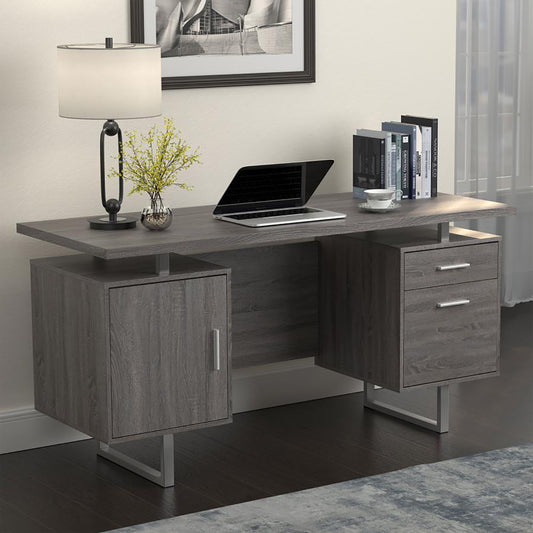 Modern grey wood executive desk with a sleek design and silver legs