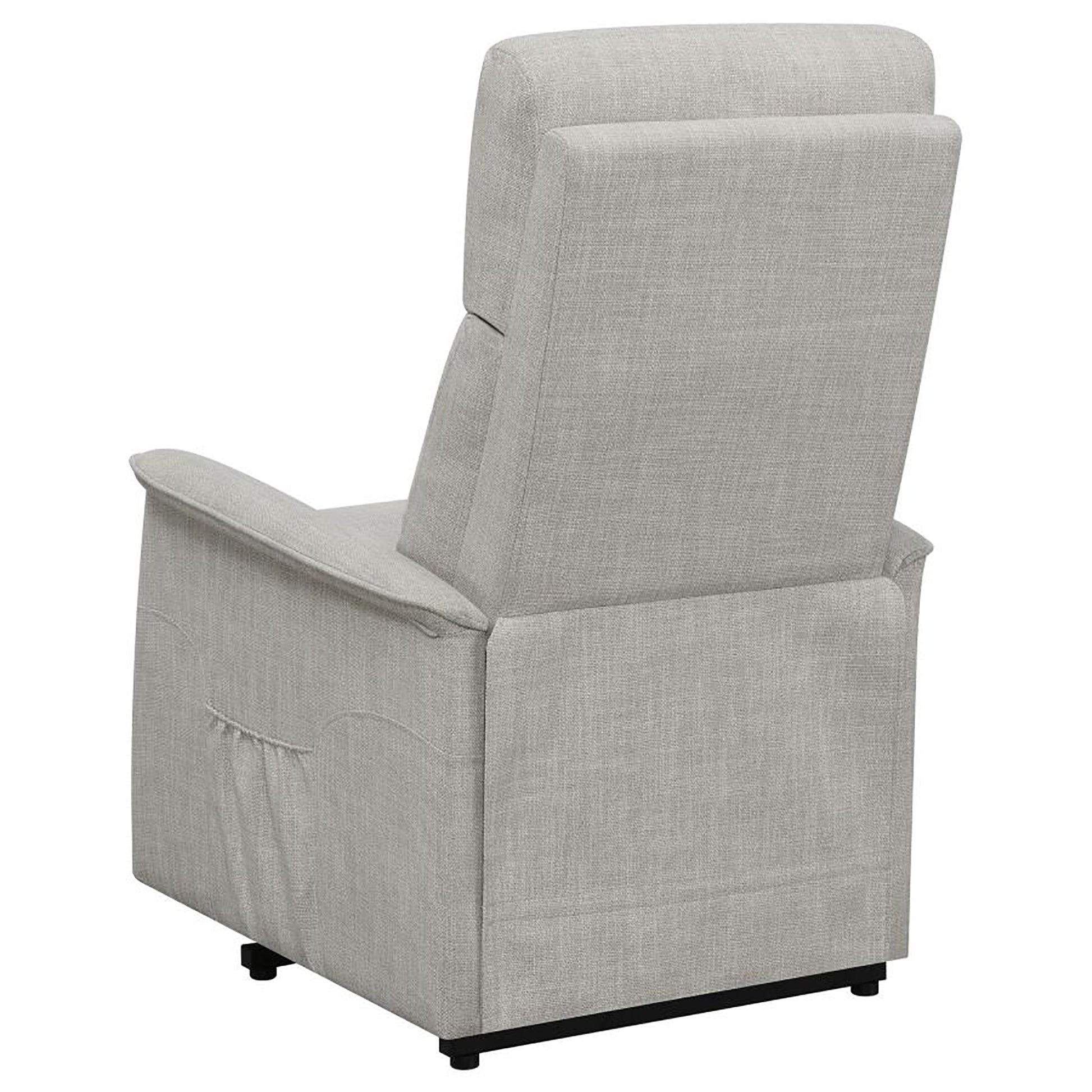 Light grey fabric recliner chair viewed from the back left with a pocket on the side