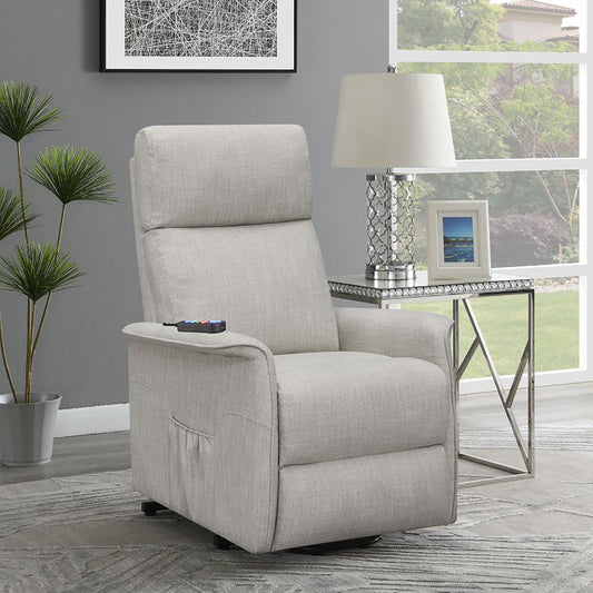 Light gray fabric lift chair recliner with remote control in a living room setting