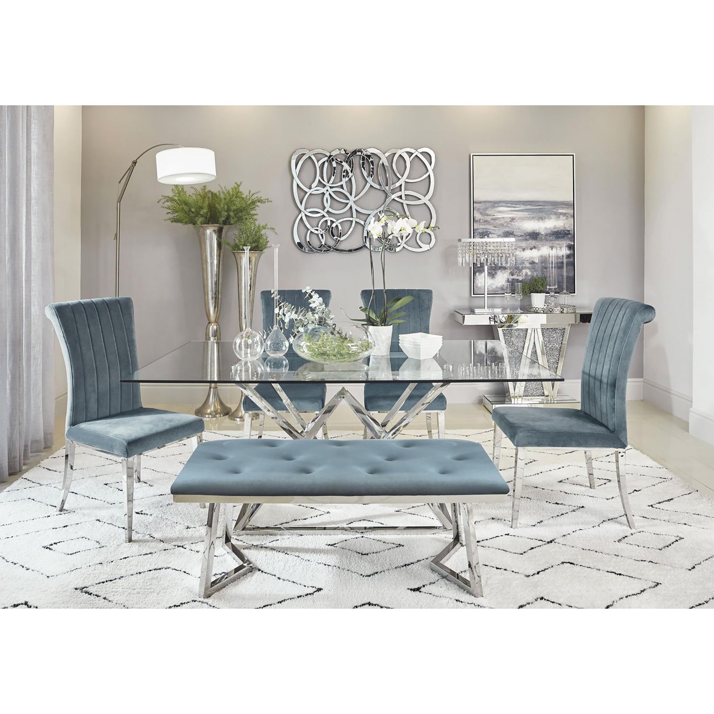 Velvet dining chair with channel tufting and polished chrome legs in a modern dining room setting