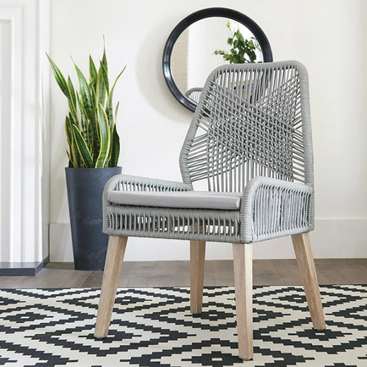 Grey woven dining chair with light wood legs and grey cushion