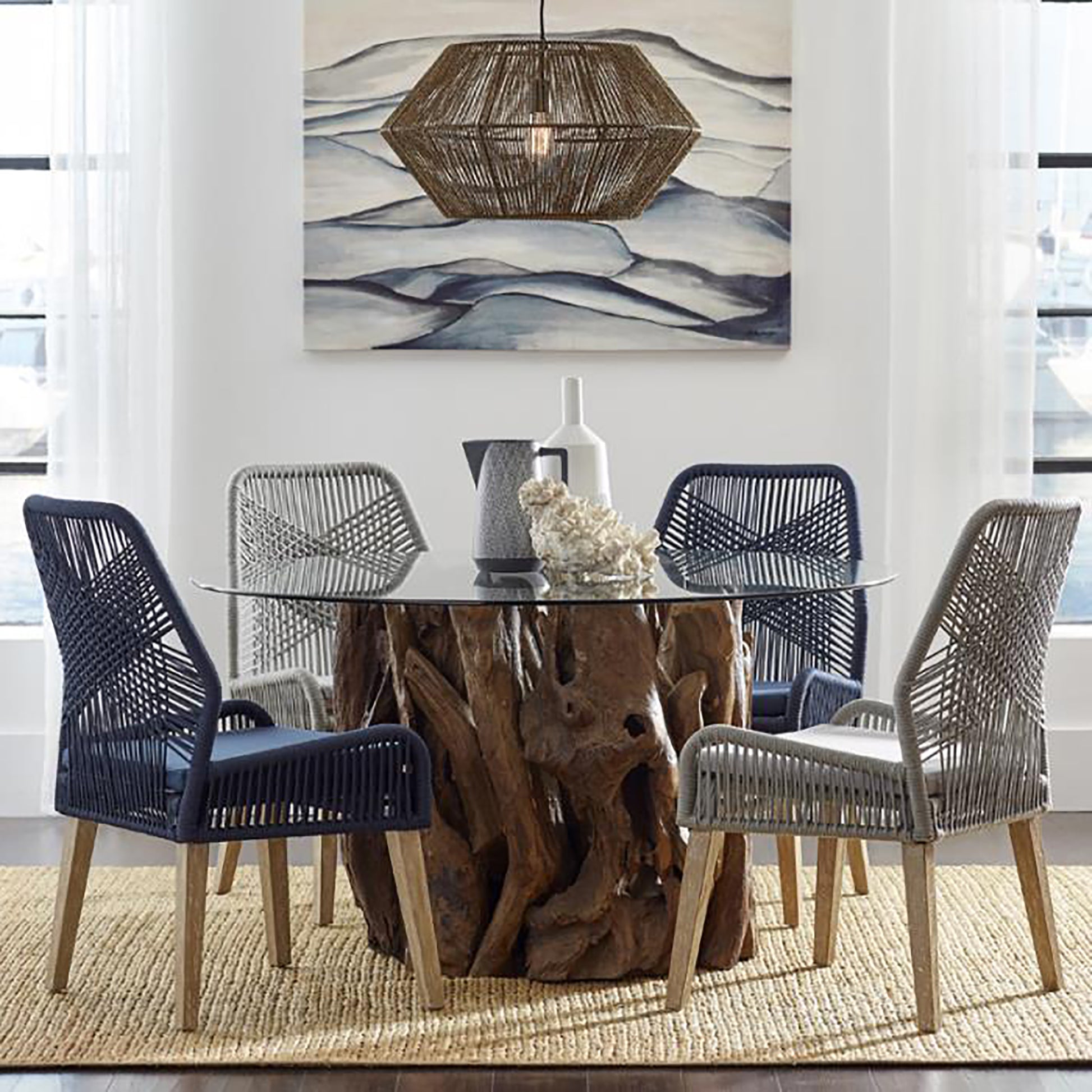 Navy woven dining chair with light wood legs and a plush seat cushion