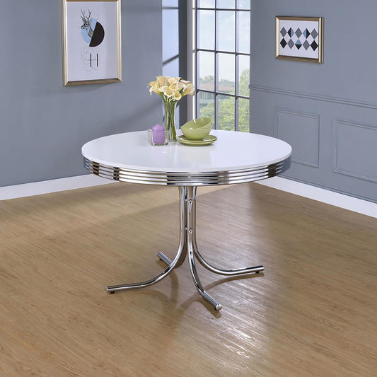 Retro chrome pedestal dining table with white tabletop and decorative chrome trim