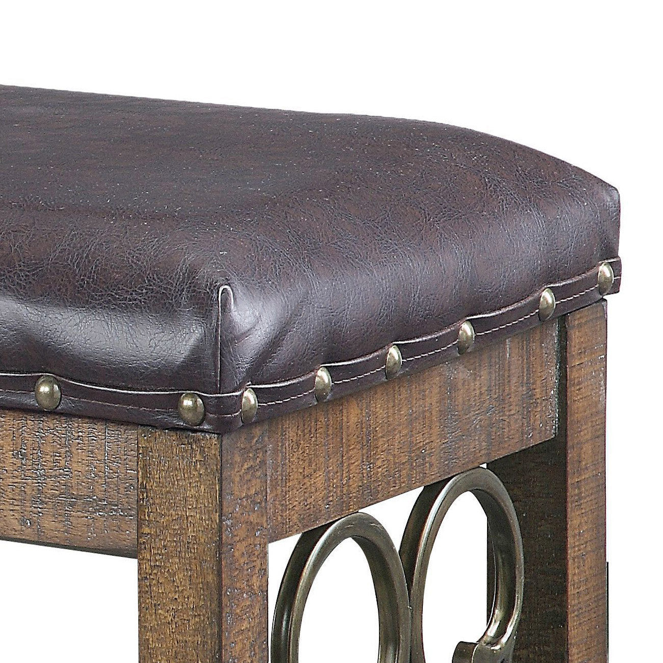 Dark brown leatherette tufted stool with brass nailhead trim and rustic wood legs