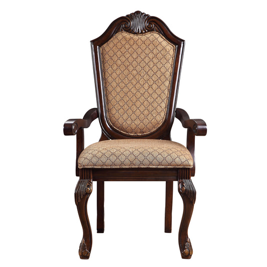 Ornate mahogany armchair with diamondpatterned tan fabric upholstery