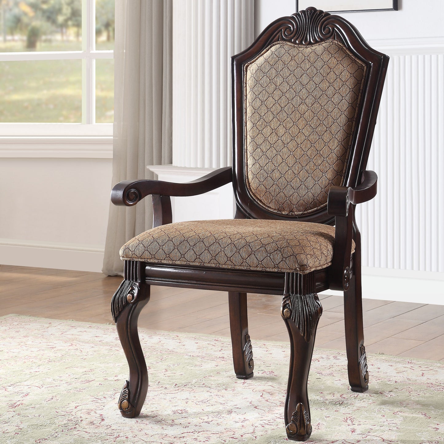 Ornate mahogany armchair with diamondpatterned upholstered seat and back