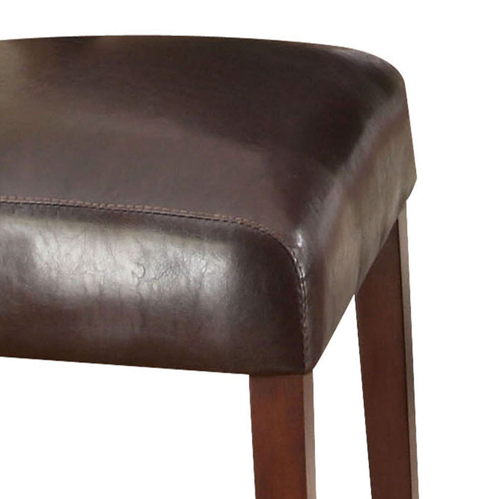 Dark brown leather seat with stitching detail on a wooden stool