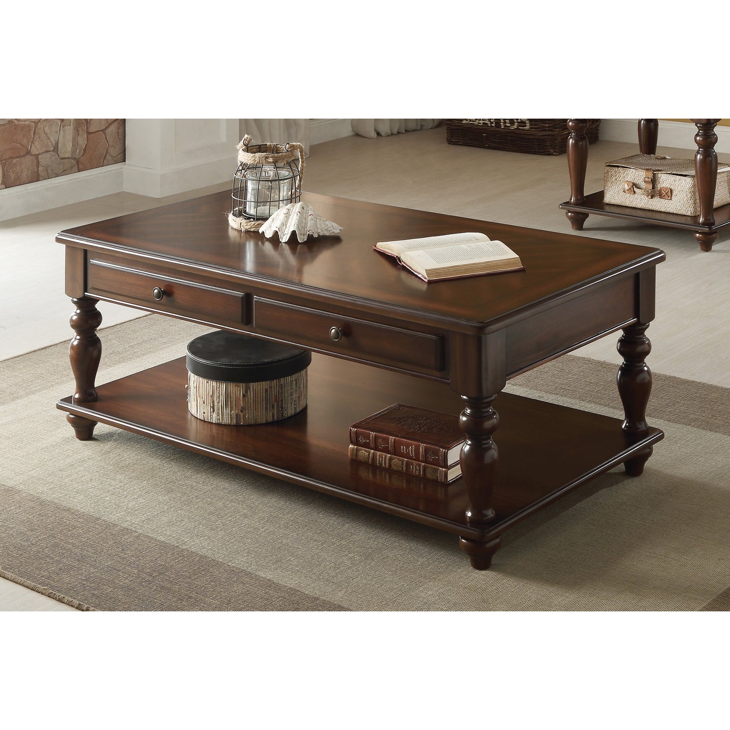Rich mahogany wood coffee table with turned legs and two drawers perfect for living rooms