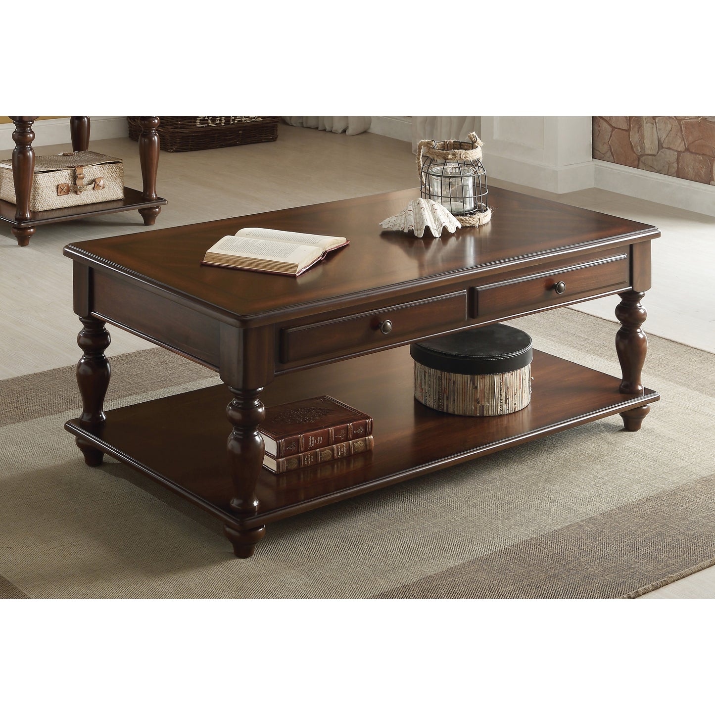Dark wood traditional coffee table with two drawers and a lower shelf featuring turned legs