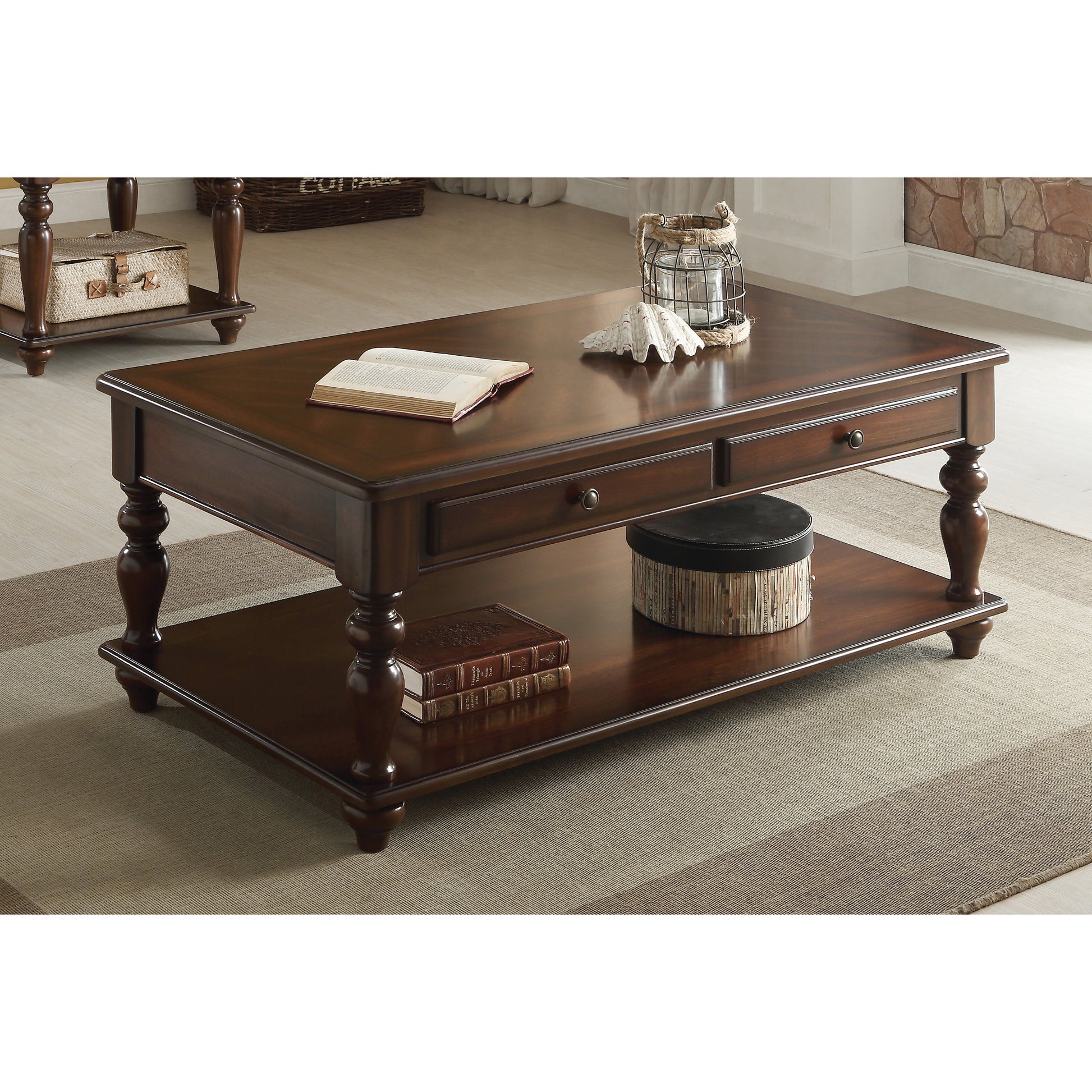 Dark wood traditional coffee table with two drawers and a lower shelf featuring turned legs