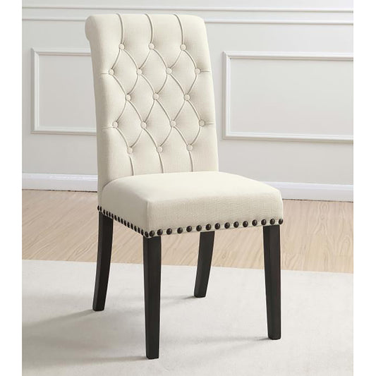 Cream upholstered dining chair with diamond tufting and nailhead trim