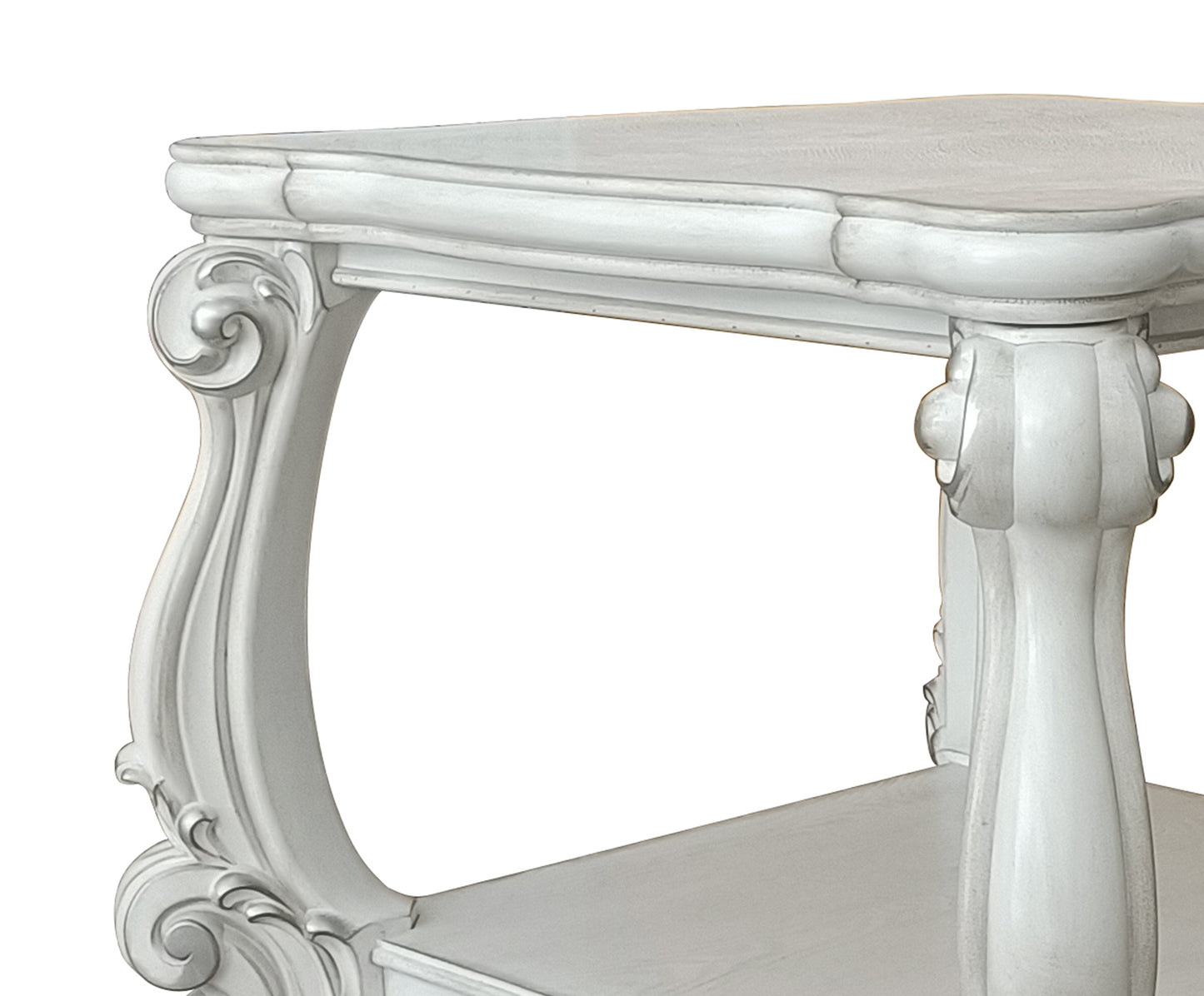 Ornate white carved wood side table with intricate scrollwork detail
