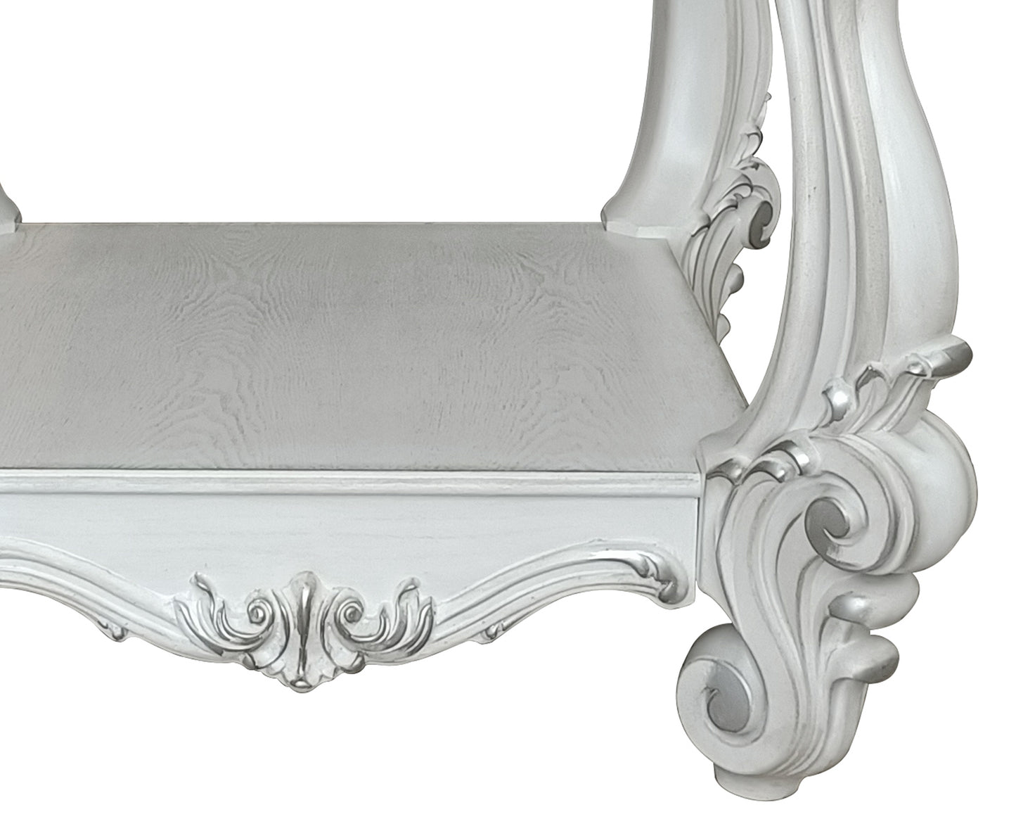 White ornate upholstered bench with carved wood detailing for a vanity table