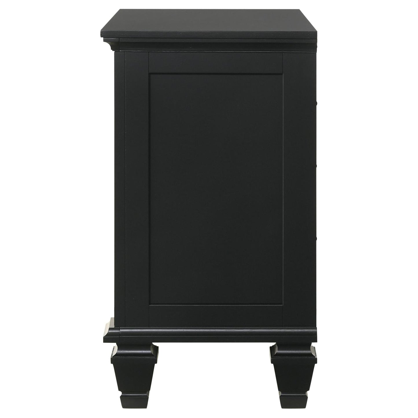 Side view of a black wooden nightstand with a paneled drawer front and decorative legs