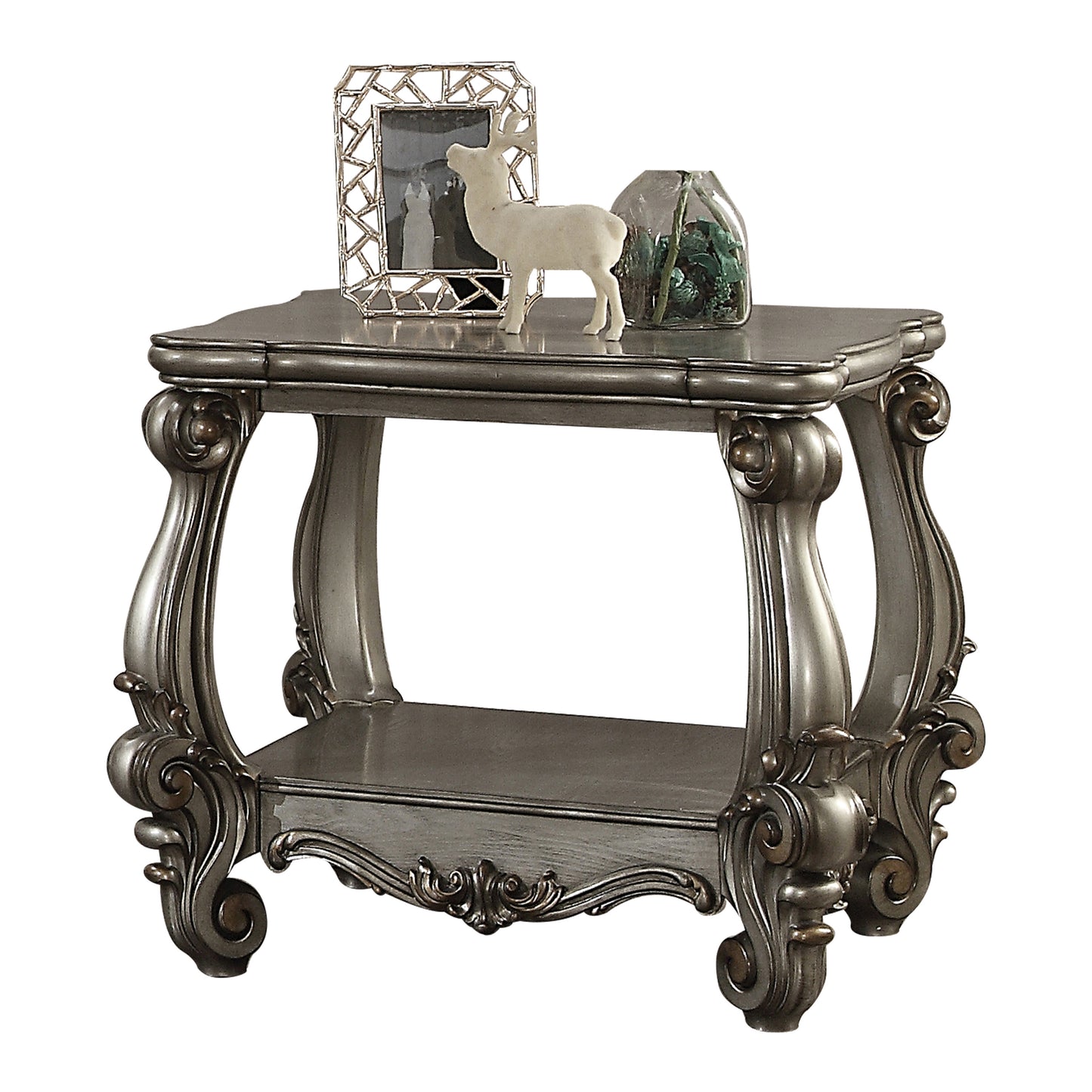 Ornate carved gray end table with lower shelf and decorative accents