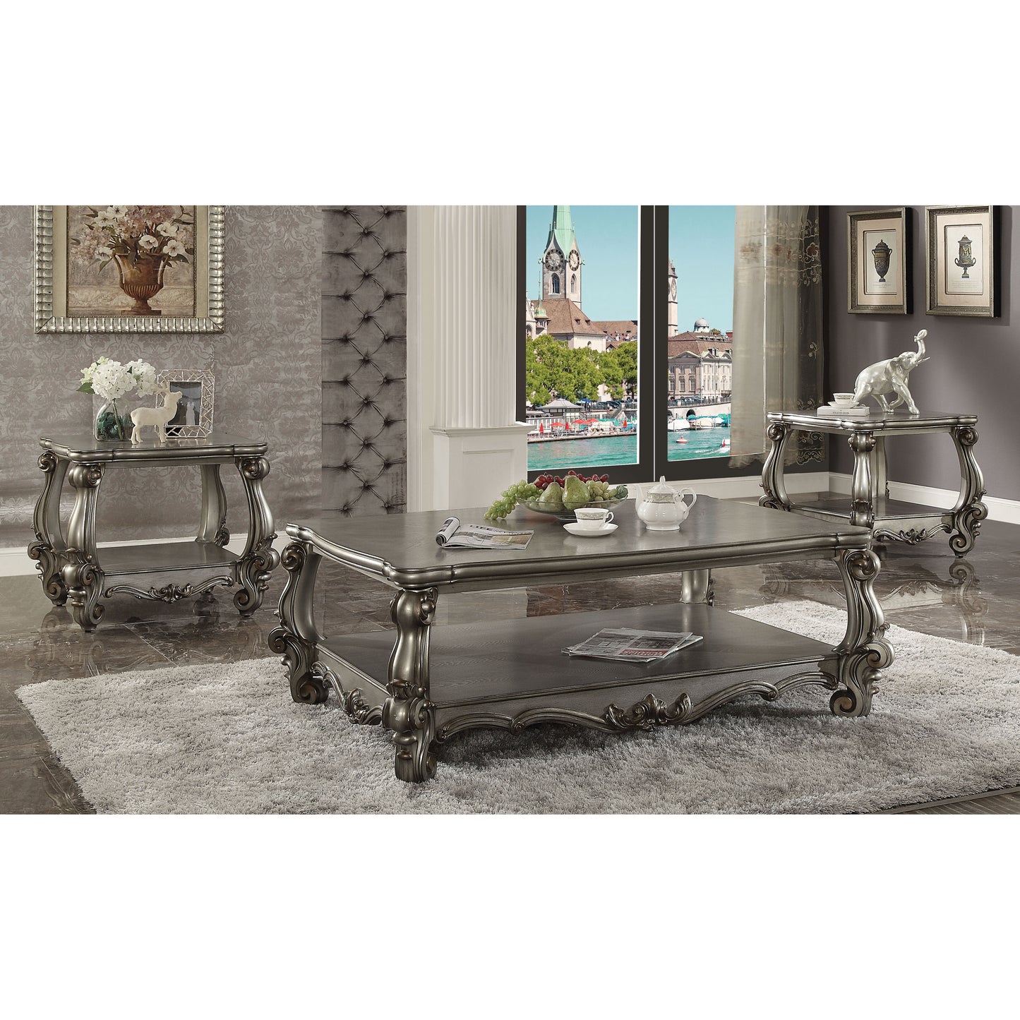 Ornate antique silver coffee table with carved legs and open shelf