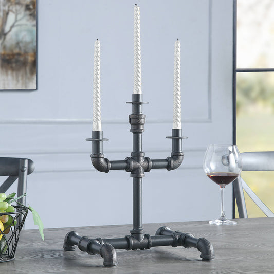 Black industrial pipe candelabra with three white twisted taper candles a statement piece