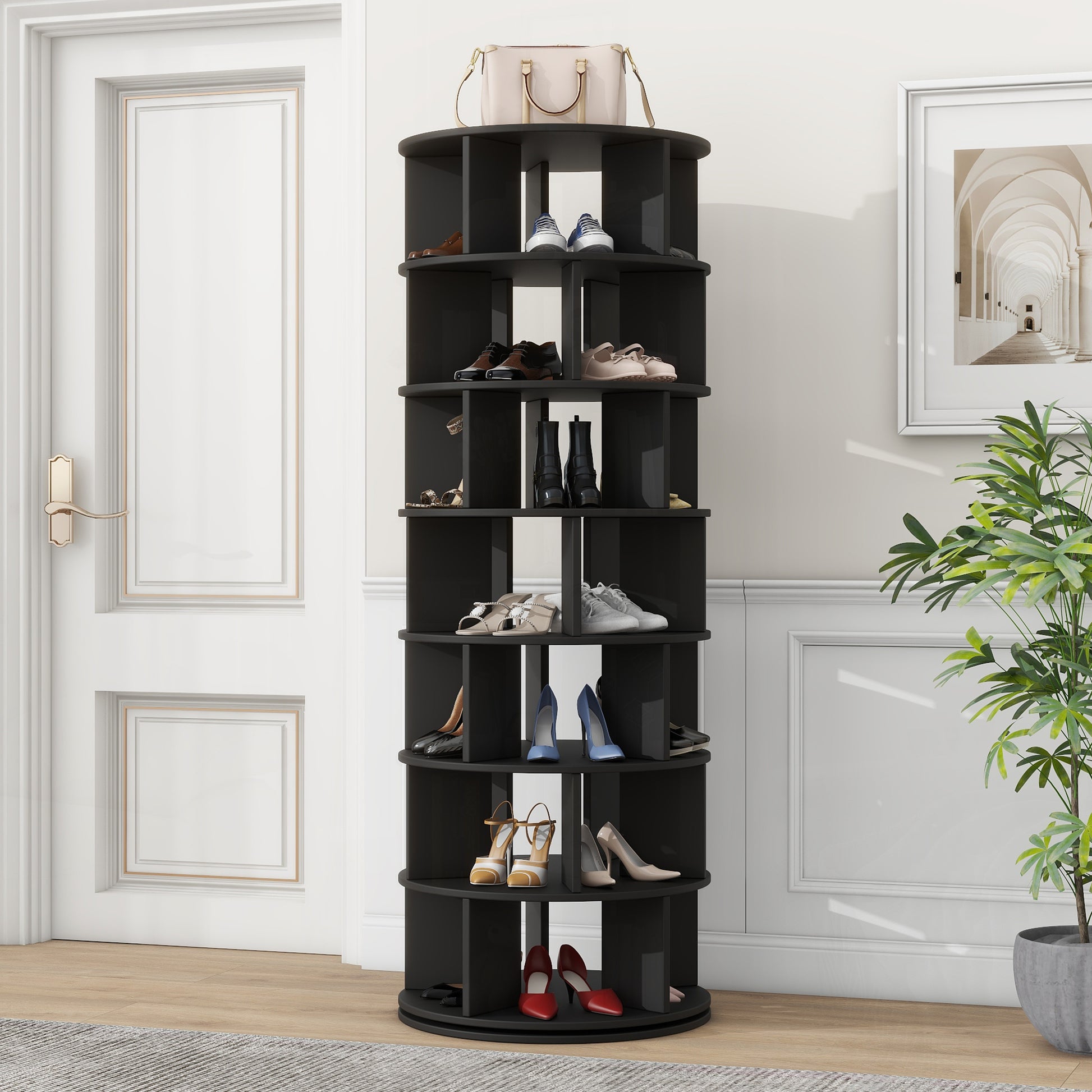 Black rotating shoe rack with leather boots and sandals on shelves