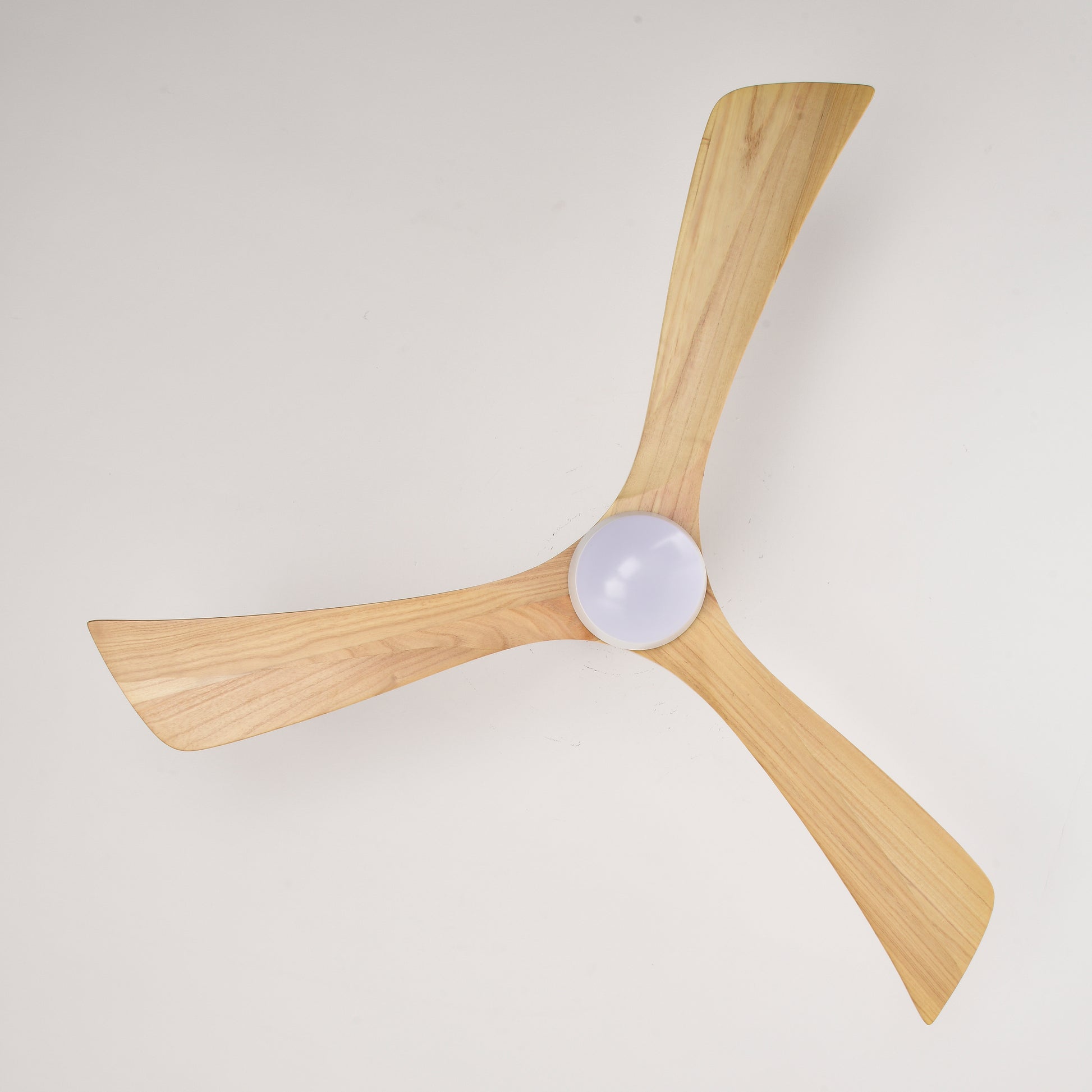 Natural wood ceiling fan with three curved blades and integrated light fixture