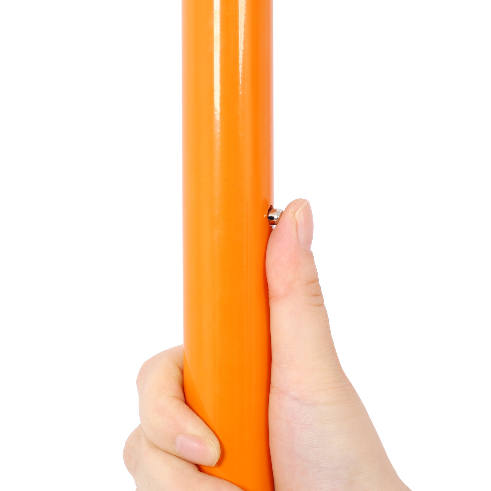 Closeup of a hand pressing the silver button on a bright orange metal pole