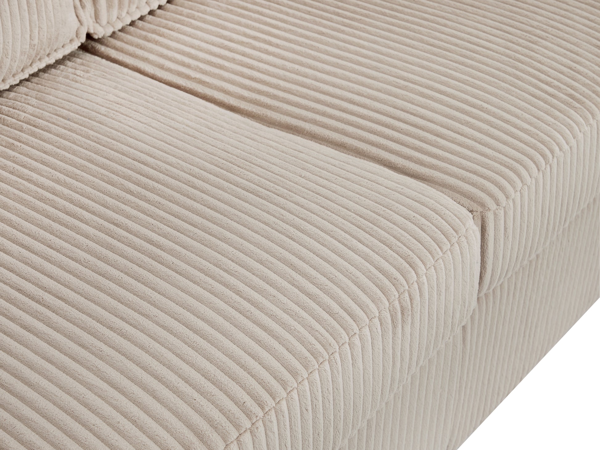 Closeup of plush beige corduroy sofa upholstery texture