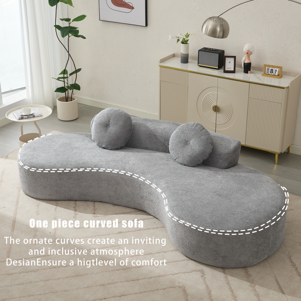 Grey fabric onepiece curved sofa with round throw pillows