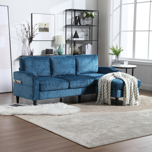 Plush teal sectional sofa with chaise and ottoman featuring a textured fabric and minimalist design