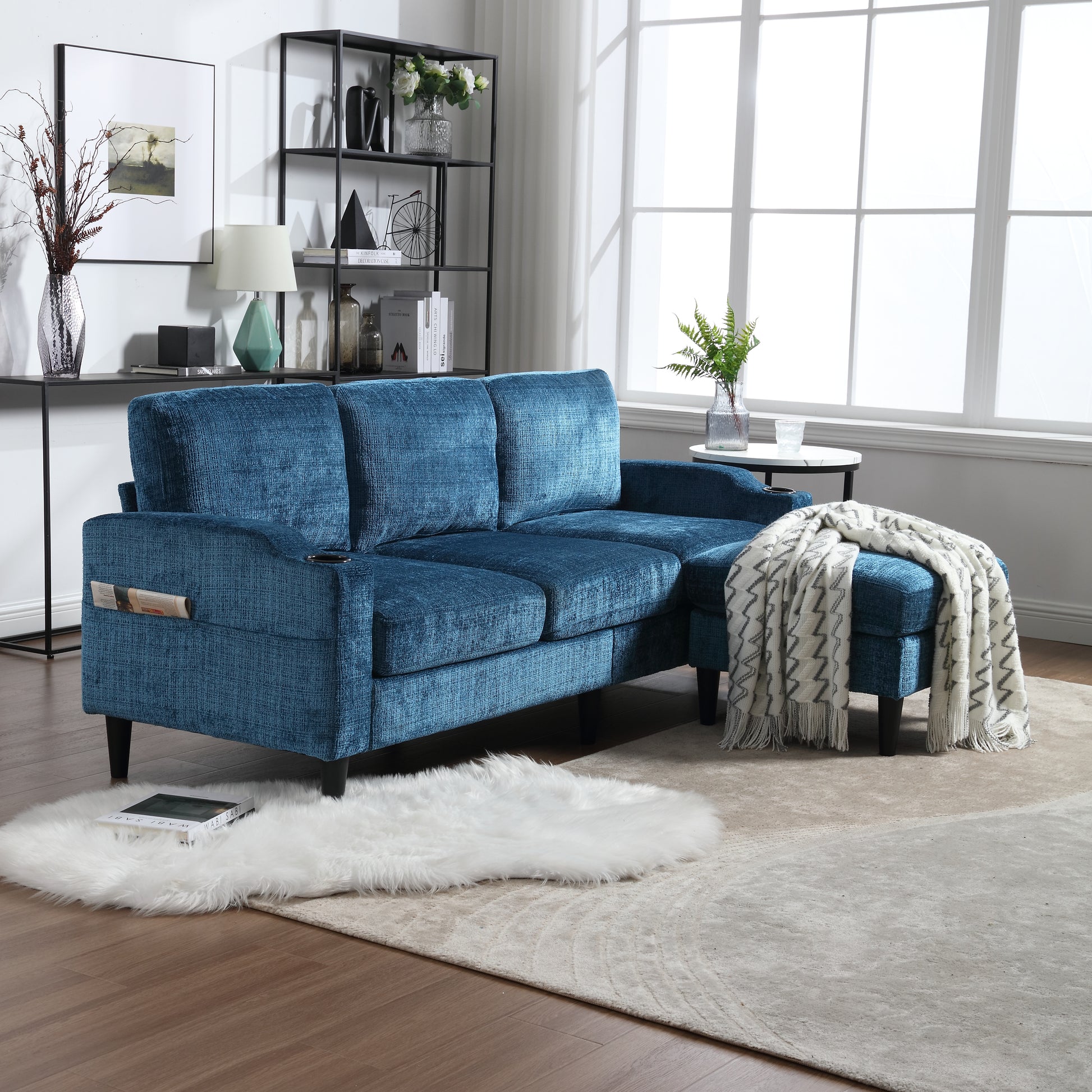 Deep blue textured fabric sectional sofa with chaise and armrest magazine holder
