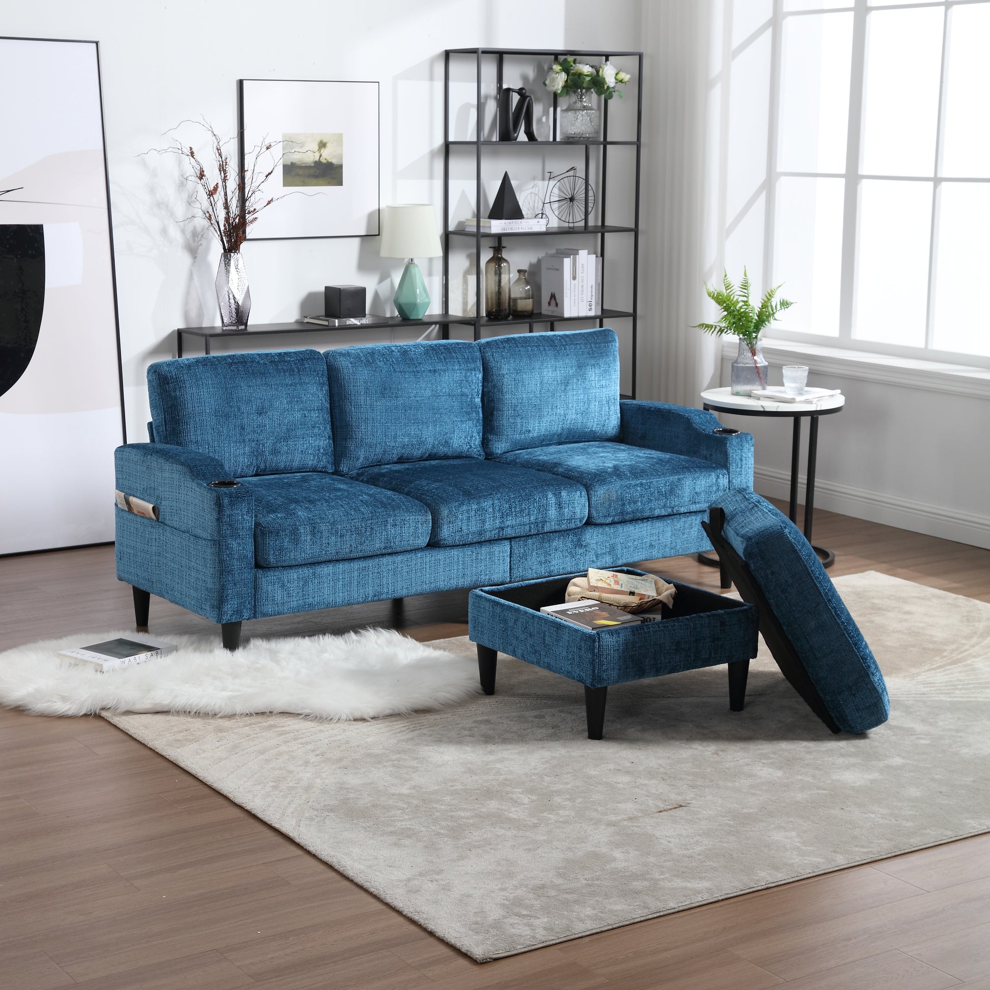 Deep blue velvet sofa with contemporary design and builtin cup holders