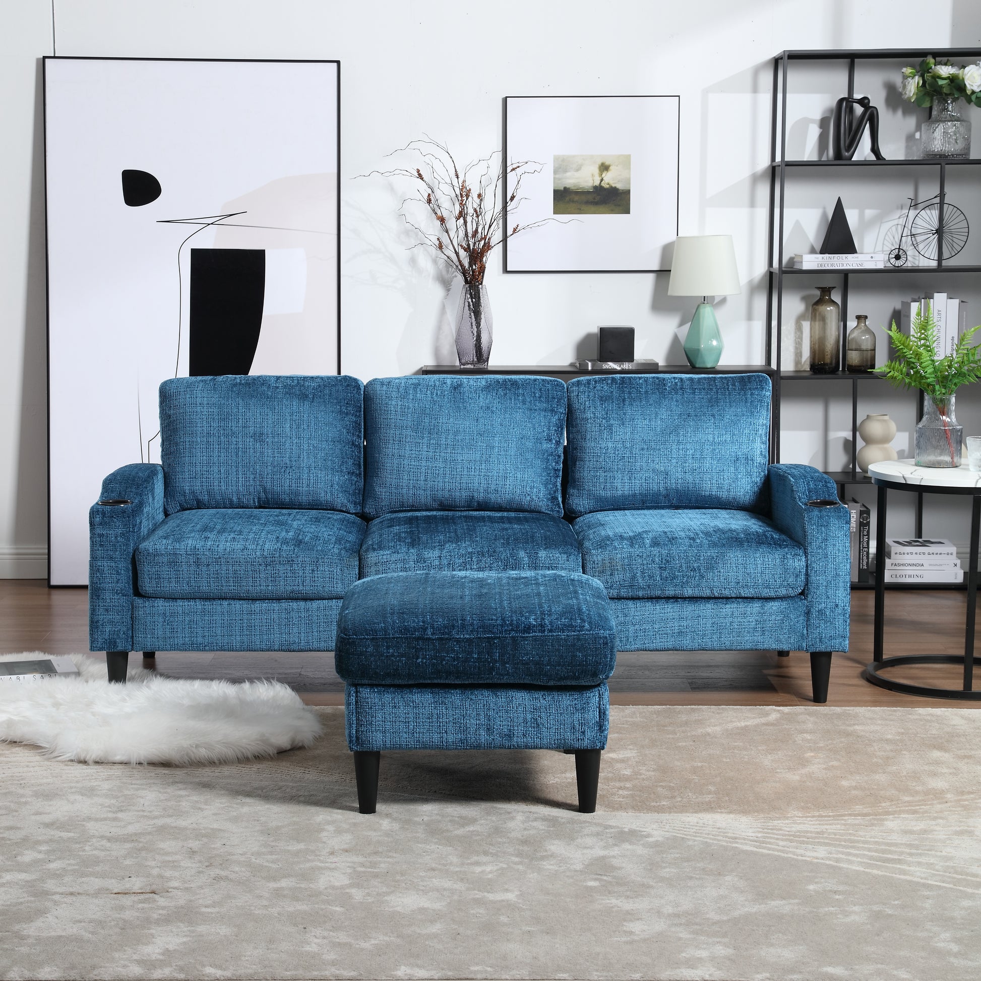 Threeseater teal velvet sofa with matching ottoman and cup holders