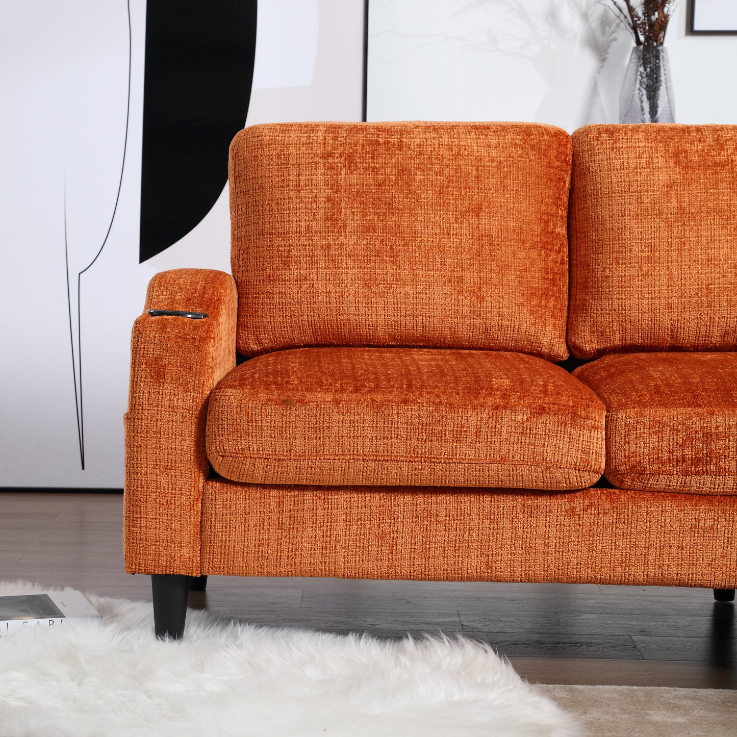 Cozy orange chenille sofa with plush cushions and builtin cup holder