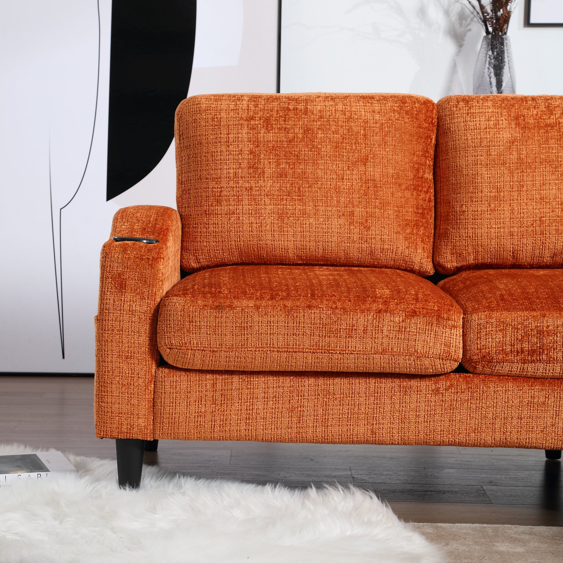 Cozy orange chenille sofa with plush cushions and builtin cup holder