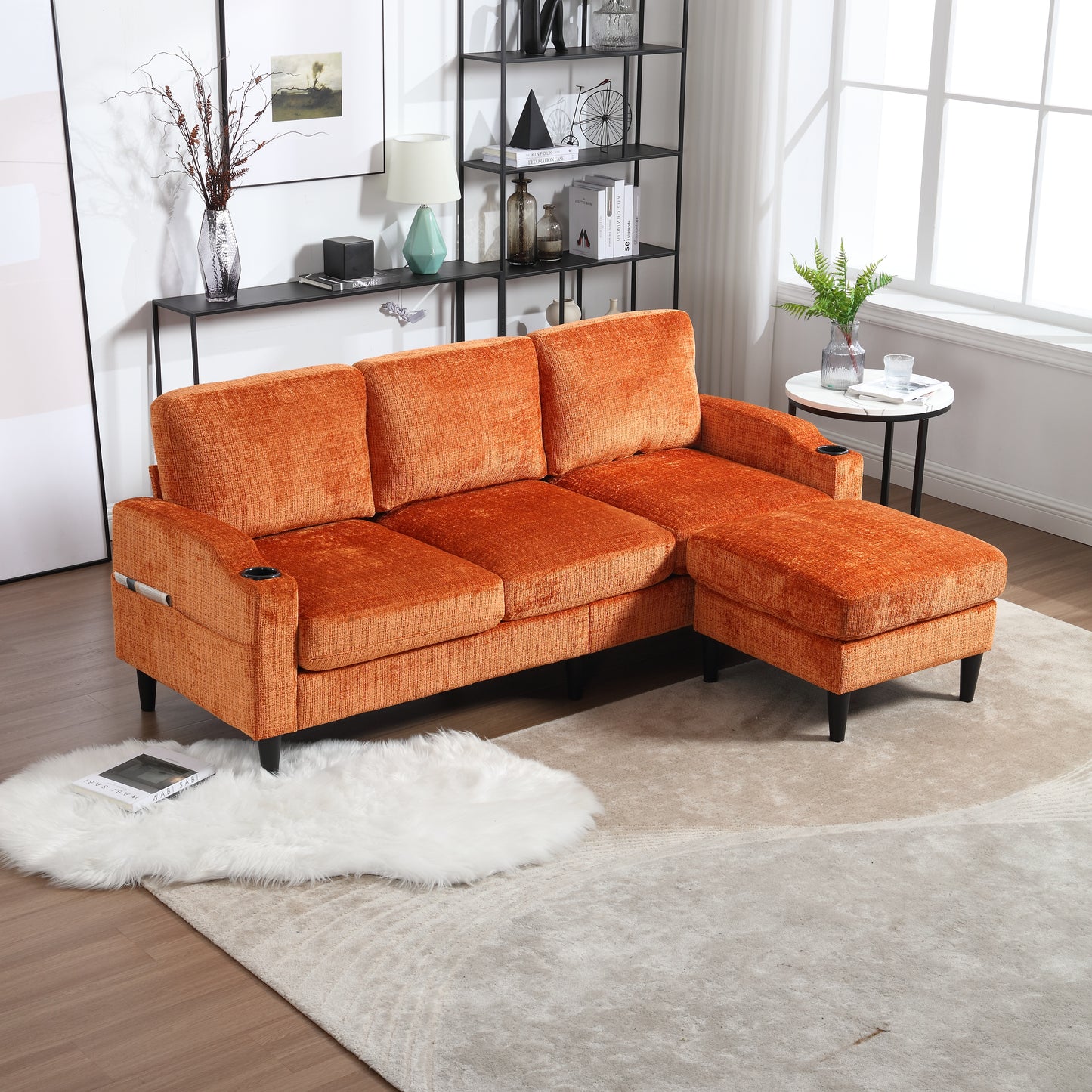 Plush orange sectional sofa with chaise featuring builtin cup holders for ultimate relaxation