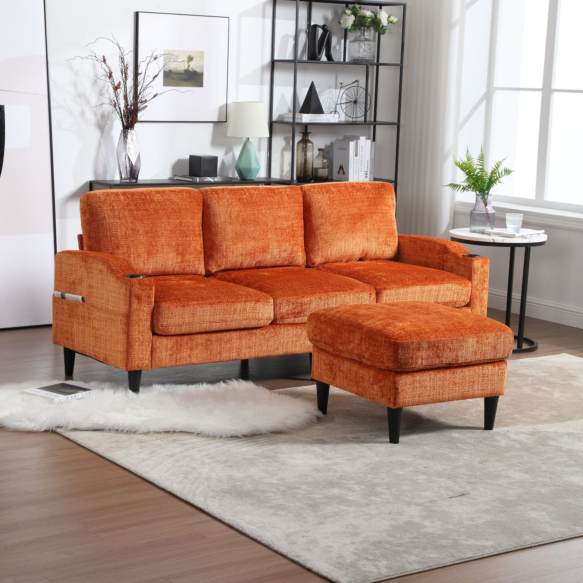 Plush orange velvet threeseater sofa with matching ottoman perfect for living room comfort
