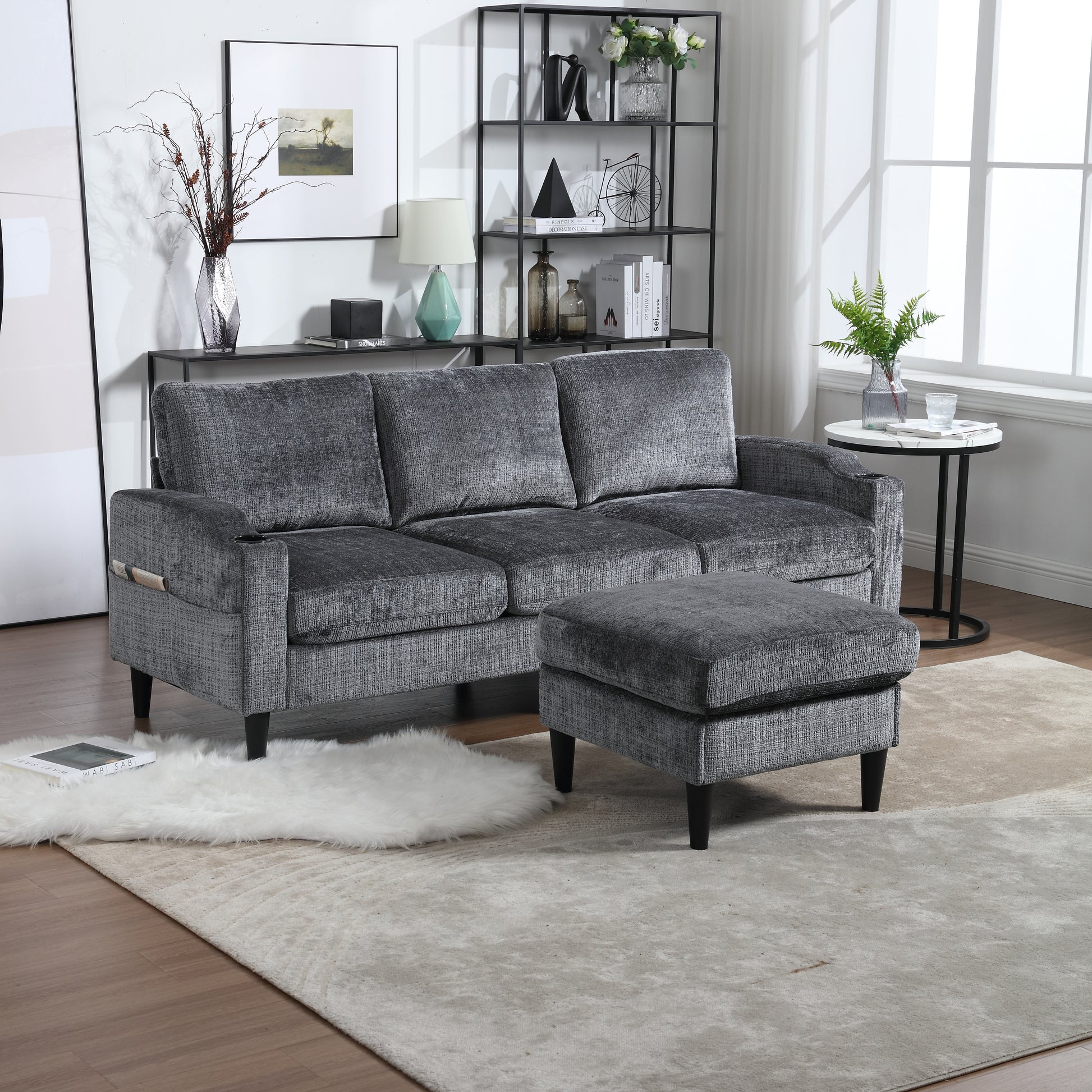 Dark grey textured fabric sofa with matching ottoman perfect for modern living rooms