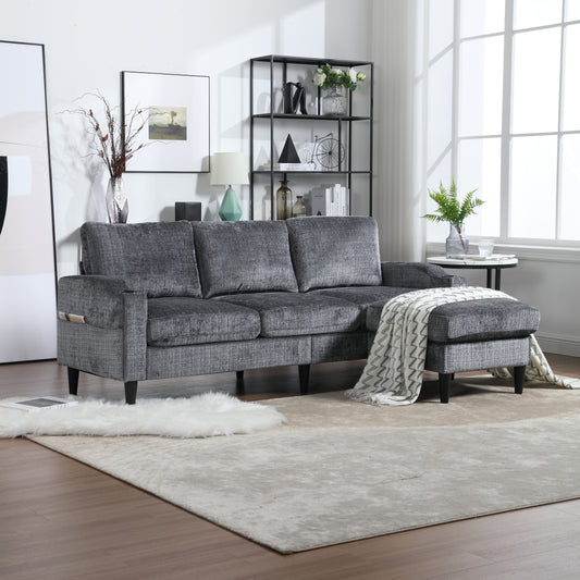 Dark grey textured sectional sofa with chaise and throw blanket for modern living room