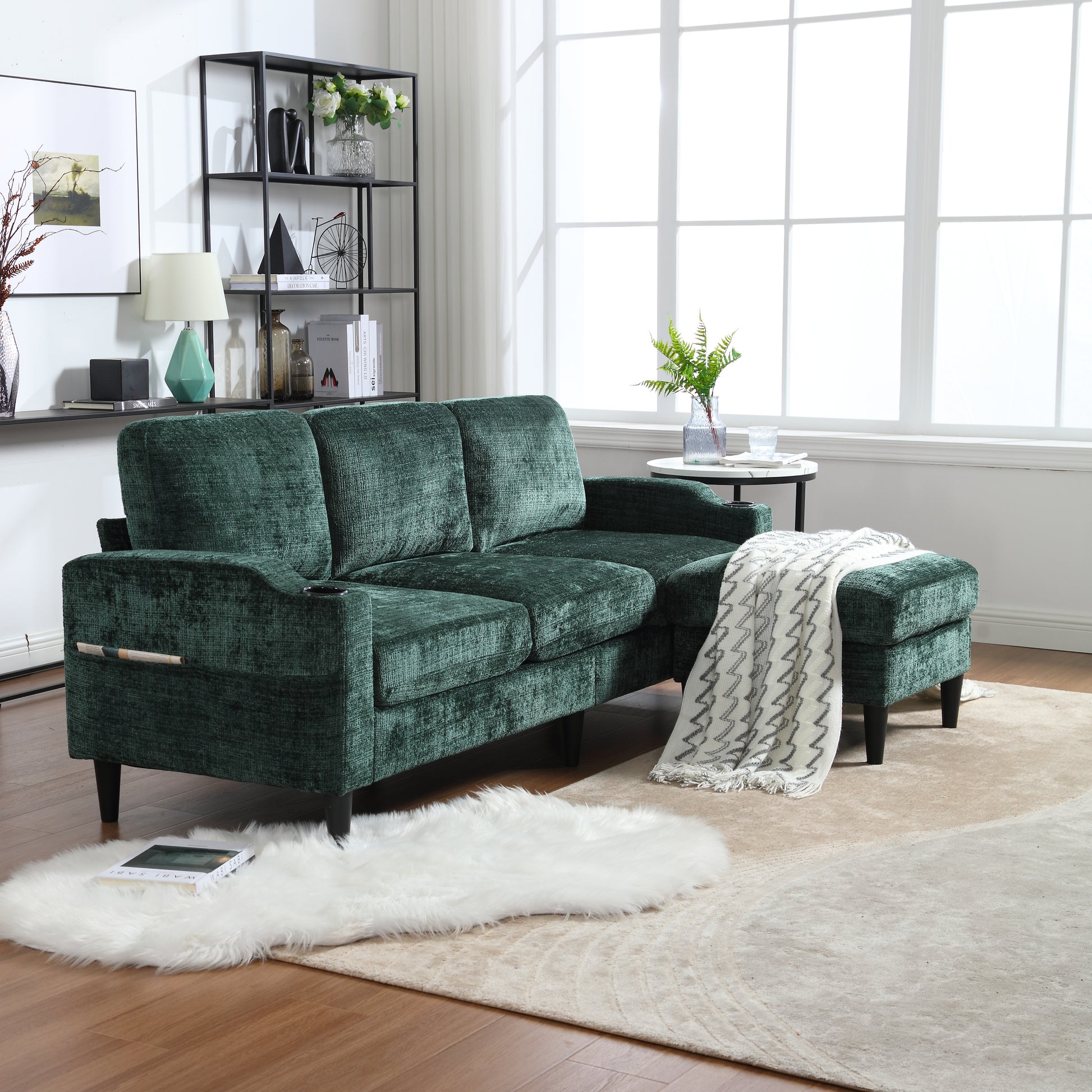 Plush emerald green velvet sectional sofa with chaise and builtin cup holders