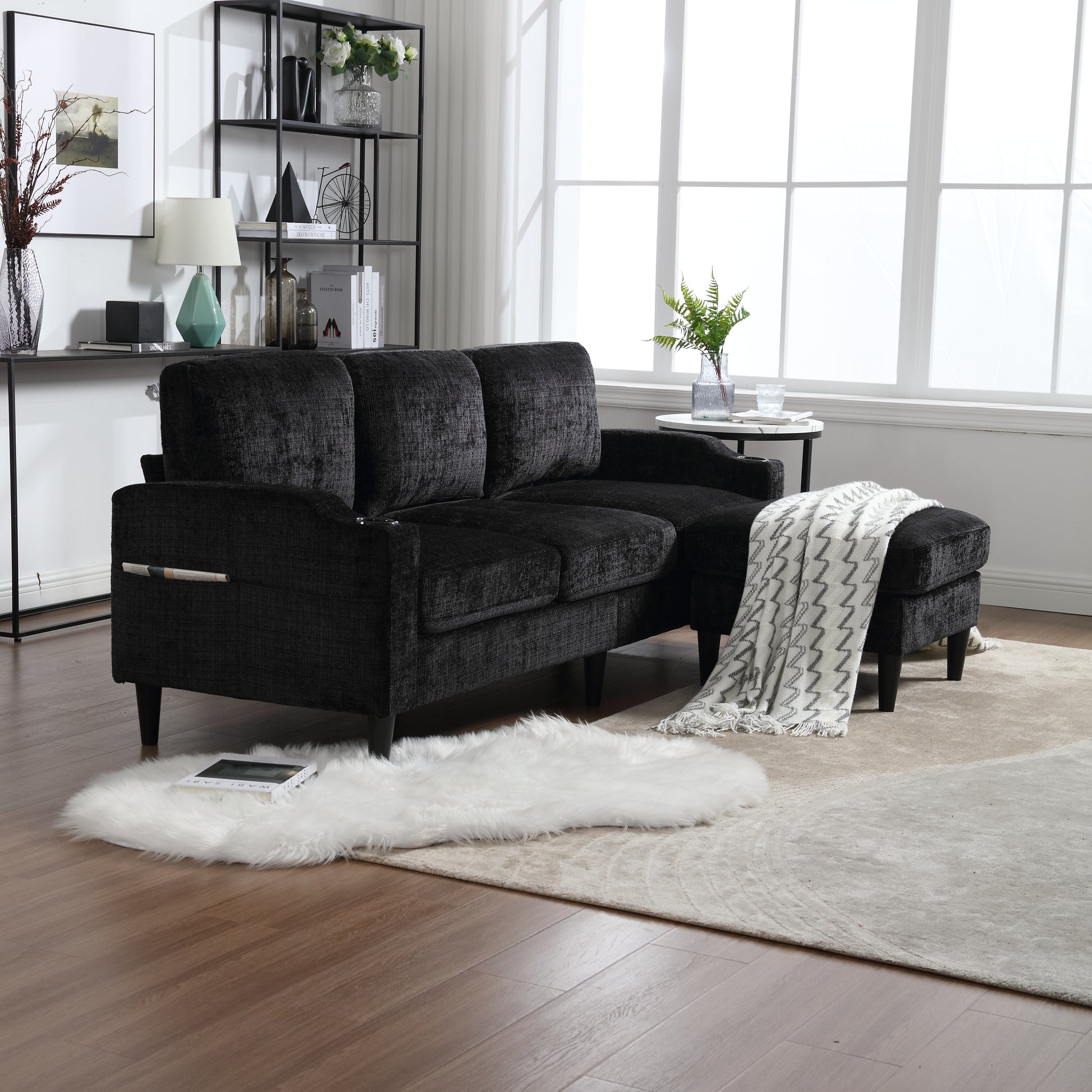 Dark textured fabric sectional sofa with chaise and an ottoman perfect for a modern living room