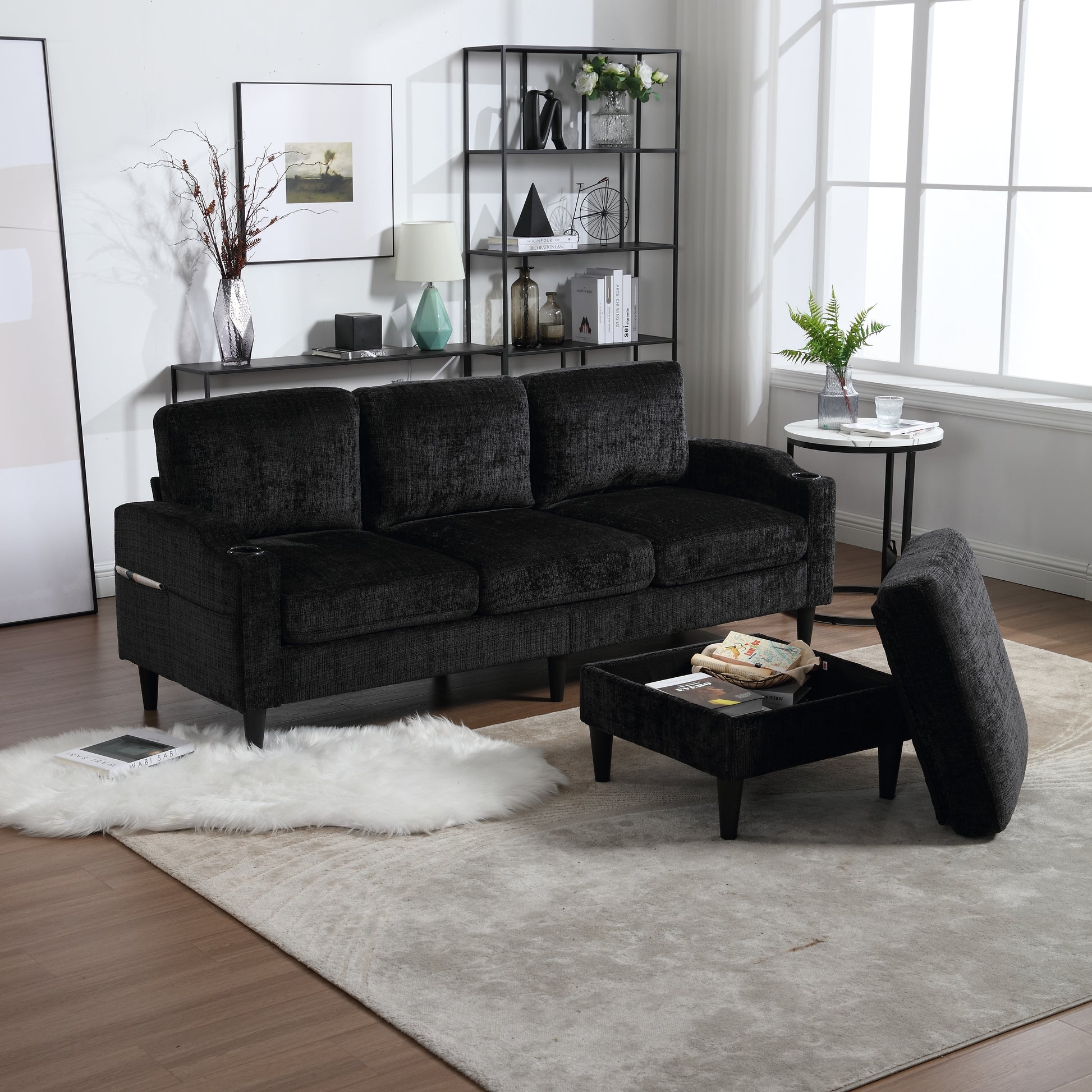 Black textured fabric sofa with three cushions and integrated cup holders for modern living rooms