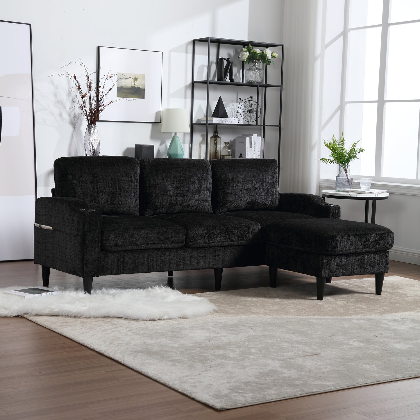Black textured fabric sectional sofa with chaise lounge and plush cushions